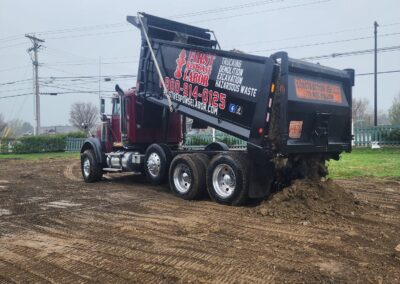 Dump truck dumping dirt